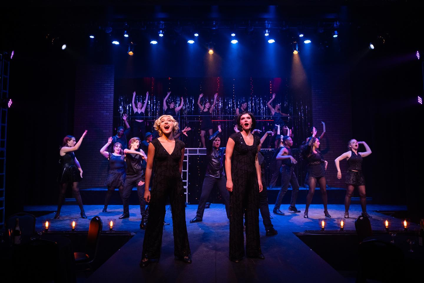 dancers and leads onstage in chicago the musical 