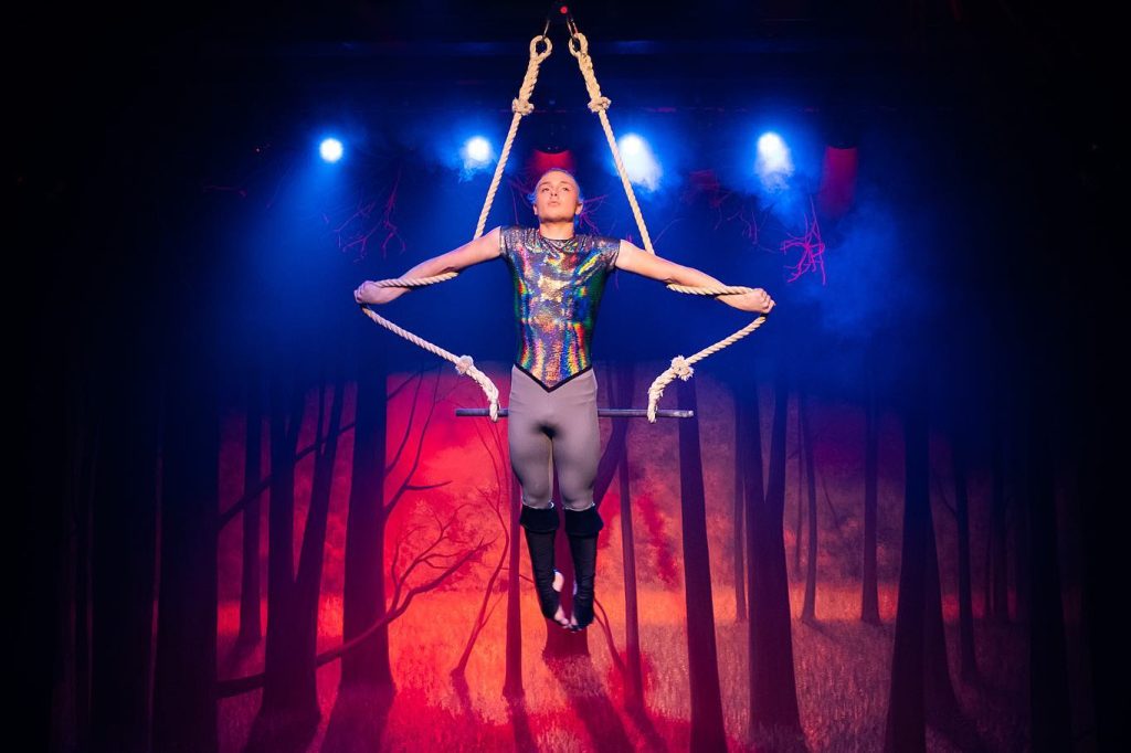 Circus performing on trapeze 