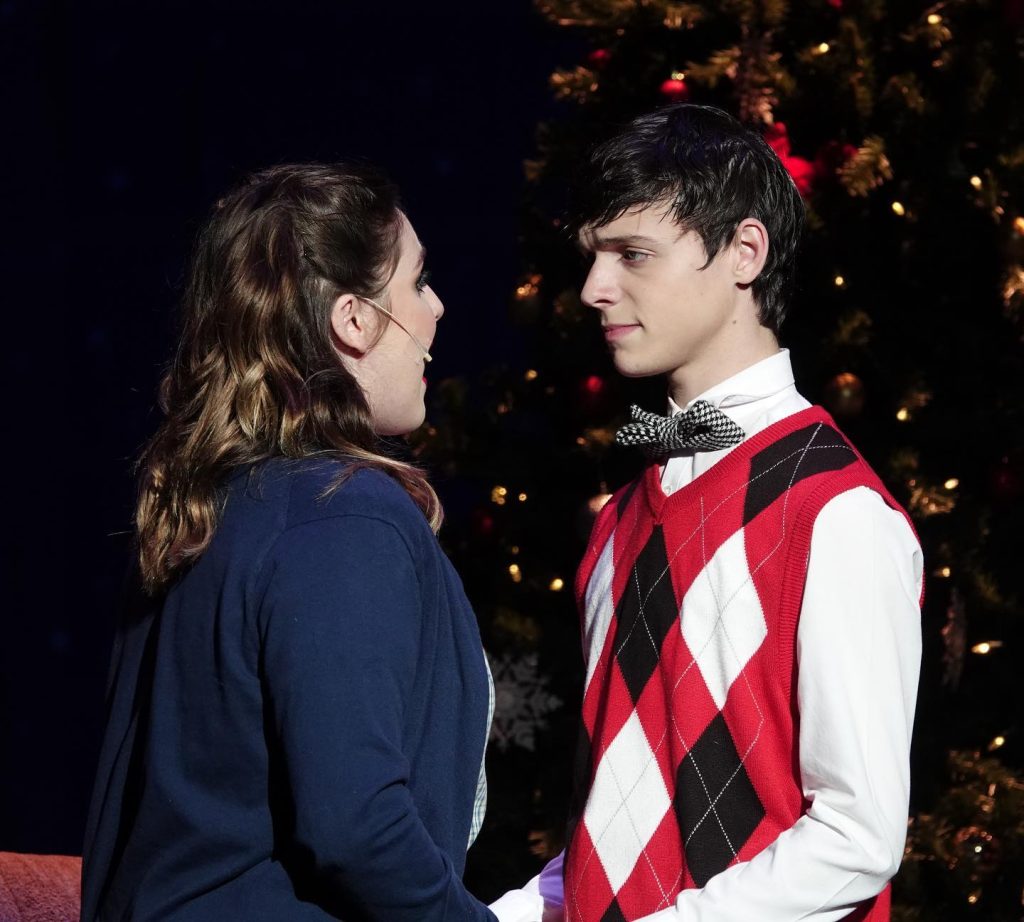 Mother and Husband in Christmas story singing to each other 