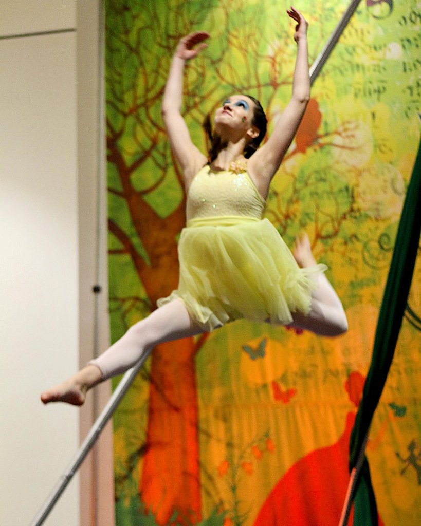 Girl Leaping in yellow dress